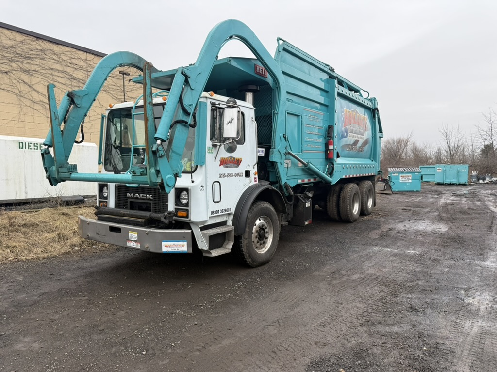 Holley frontload garbage truck servicing commercial containers