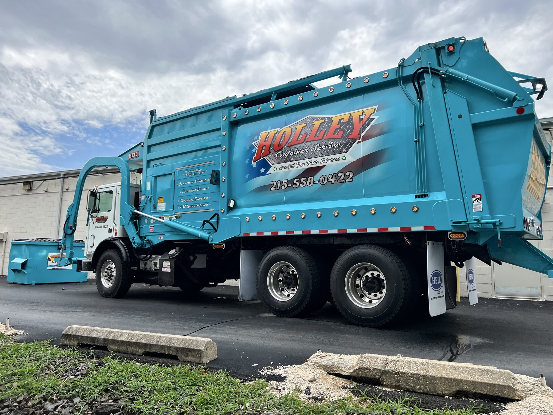 Holley rolloff trucks at a transfer station